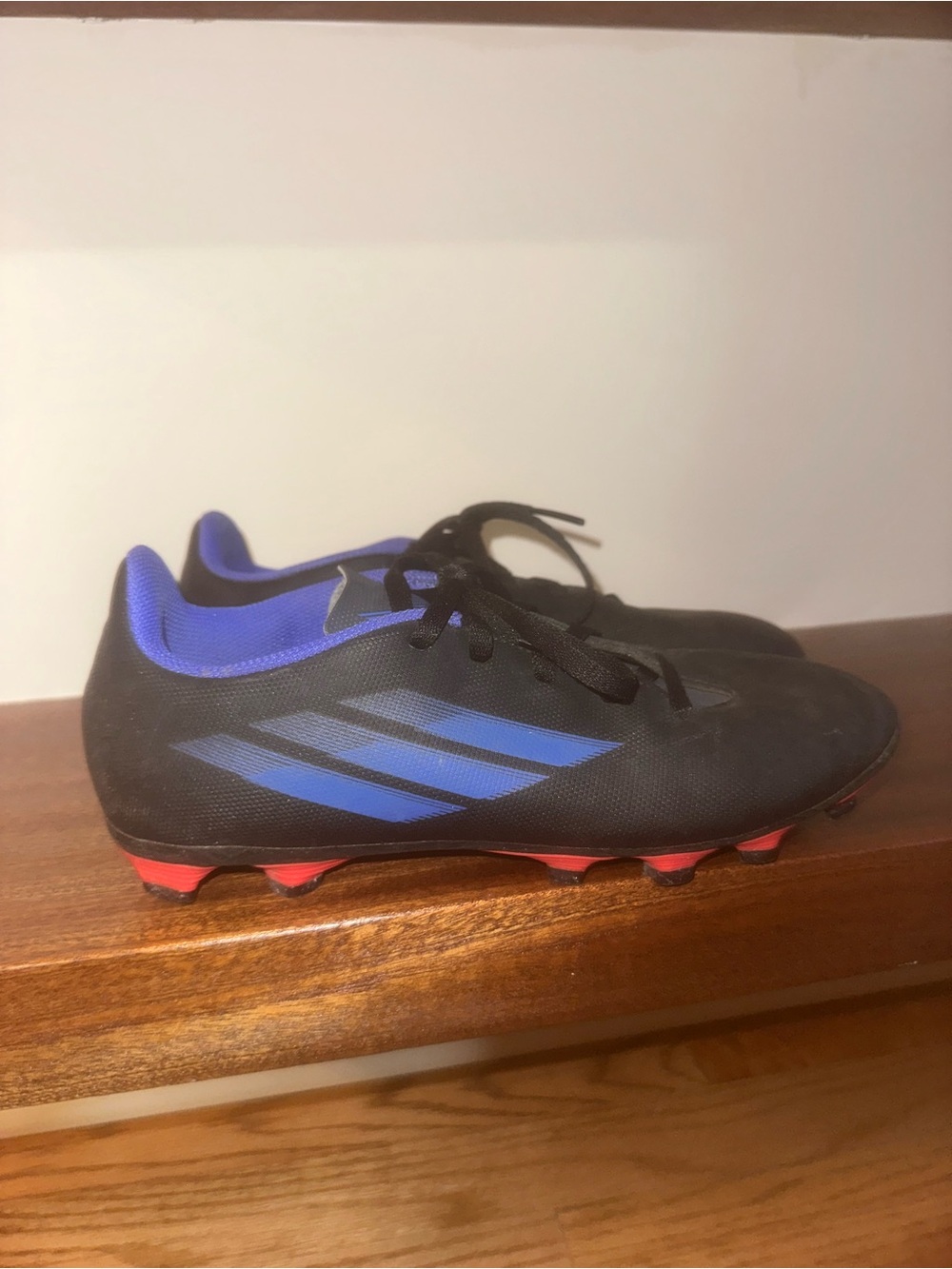 adidas Black Cleats with Blue Accents and Red Studs